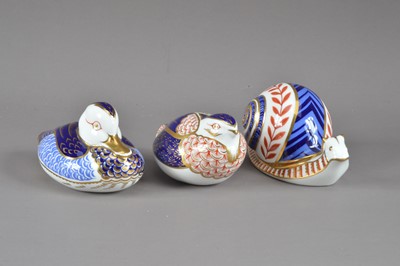 Lot 201 - Three Royal Crown Derby bone china paperweights