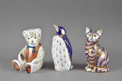 Lot 202 - Three Royal Crown Derby bone china paperweights
