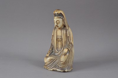 Lot 305 - A carved alabaster Buddha