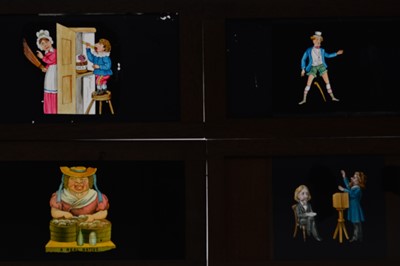 Lot 24 - Mahogany-Mounted Slipping Magic Lantern Slides