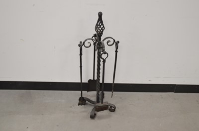 Lot 26 - A modern black painted cast iron fire side set