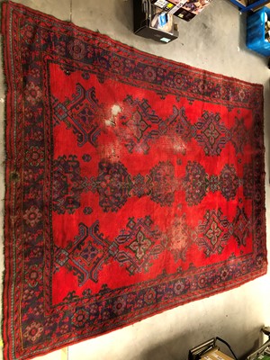 Lot 45 - A large and damaged colourful oushak woollen rug