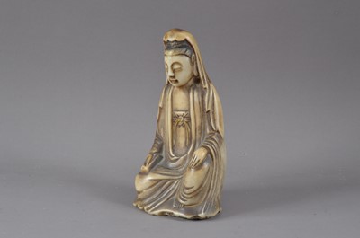 Lot 204 - A carved alabaster Buddha