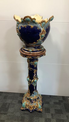Lot 263 - A ceramic jardinière and stand