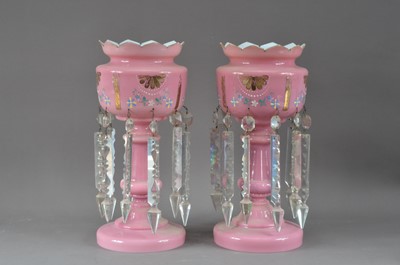 Lot 280 - A pair of late 19th or early 20th century pink glass lustres