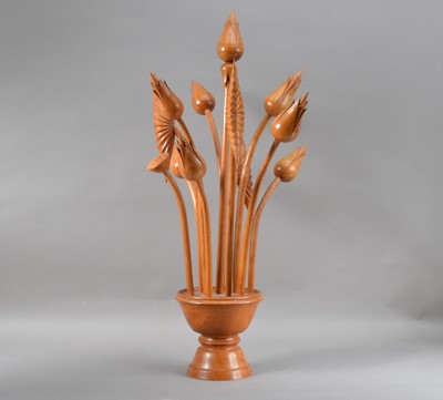 Lot 185 - A carved hardwood sculpture of flowers
