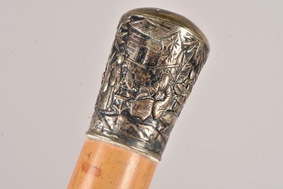 Lot 88 - A white metal topped Oriental walking cane