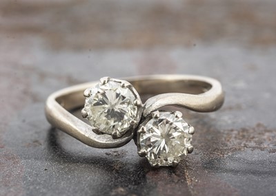 Lot 4 - An 18ct gold diamond crossover dress ring