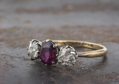Lot 7 - An 18ct gold platinum set three stone ruby and diamond ring