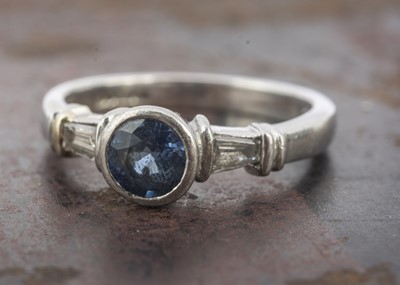 Lot 44 - A three stone white 18ct gold sapphire and diamond ring