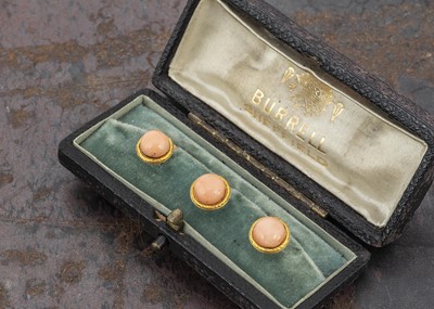 Lot 74 - A set of three 15ct gold coral dress studs