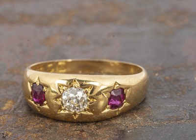 Lot 103 - A Victorian ruby and diamond set three stone band
