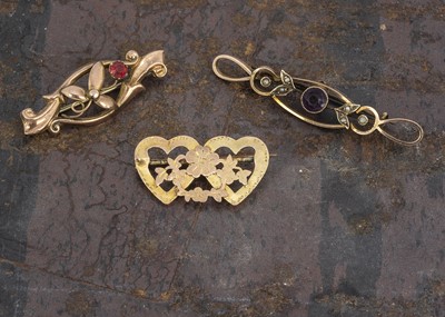 Lot 132 - Three yellow metal bar brooches