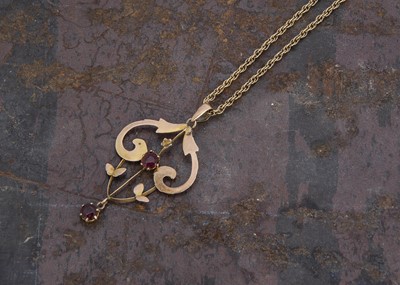 Lot 139 - A 9ct gold and red paste Art Nouveau pendant