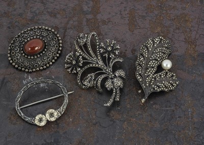 Lot 145 - A collection of four silver brooches