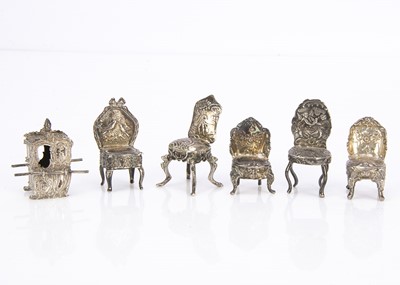 Lot 537 - A group of four Edwardian period silver miniature dining chairs