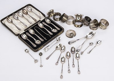 Lot 541 - A collection of silver napkin rings and teaspoons