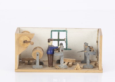 Lot 448 - An Erzgebirge workroom with man at lathe