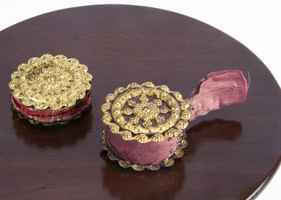 Lot 710 - Two 19th century gilt metal pin cushion wheels
