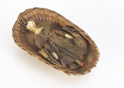 Lot 757 - A tiny mid 19th century dolls’ house Grodnerthal wooden doll
