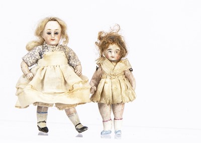 Lot 829 - Two all-bisque dolls’ house dolls