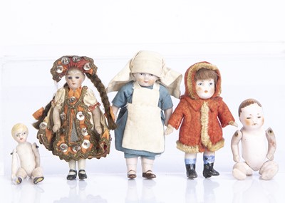 Lot 869 - Five all-bisque dolls’ house dolls