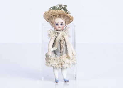 Lot 874 - An all-bisque dolls’ house doll or Mignonette