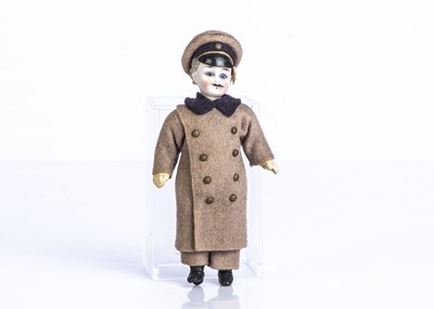 Lot 875 - A German bisque headed dolls' house chauffeur