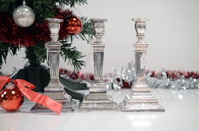 Lot 23 - A set of three modern silver filled candlsticks