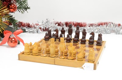 Lot 45 - A mid twenith century chess board and chessmen