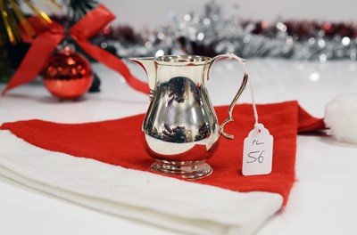 Lot 56 - A 1970s good quality silver cream jug by Garrard & Co