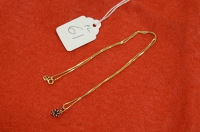 Lot 61 - A modern ruby and sapphire pendant