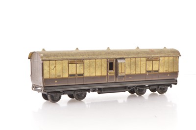 Lot 41 - A Carette tinplate L&NWR  chocolate and cream Guards/Parcel bogie Van