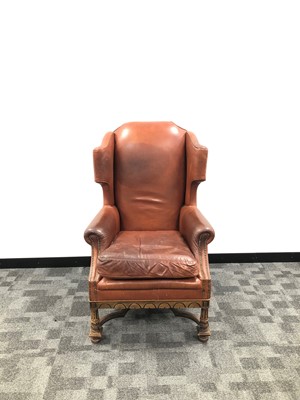 Lot 15 - An early 20th century leather wingback armchair
