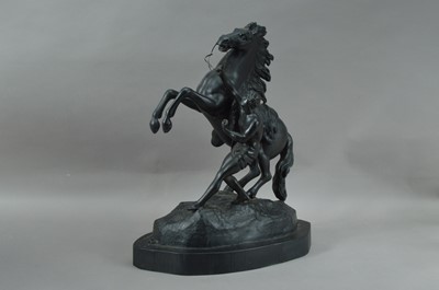 Lot 182 - A modern metal sculpture of a stallion and man