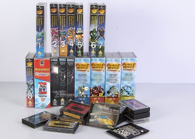 Lot 553 - Transformers VHS, Annuals & Other Collectables