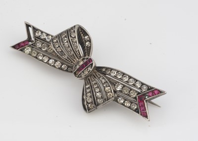 Lot 8 - A continental white metal and paste set bow brooch