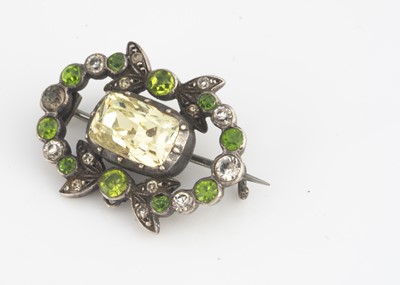Lot 59 - A late 19th or early 20th Century silver and foil backed paste set bow brooch