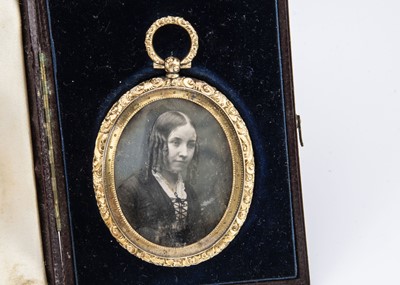 Lot 65 - A 19th Century gilt metal and photographic oval locket