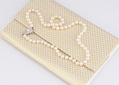 Lot 114 - A string of Mikimoto uniform knotted strung cultured pearls