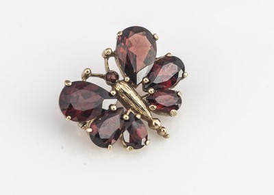 Lot 147 - A 9ct gold garnet butterfly brooch