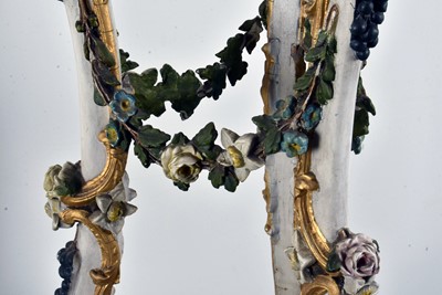 Lot 30 - A near pair of late 19th century wood and gesso open-work torchiers