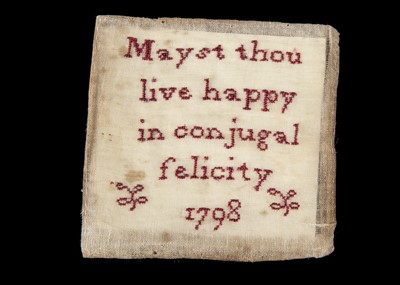 Lot 2 - A 18th century miniature sampler