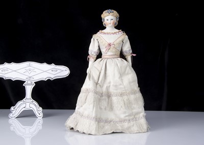 Lot 20 - A rare Kling bisque shoulder-head doll with glass eyes and sculpted dress edge