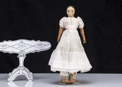 Lot 26 - An unusual early 19th century English dipped wax over papier-mache shoulder-head doll
