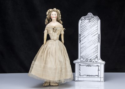 Lot 34 - A rare mid 19th century pink tinted wigged shoulder-head doll