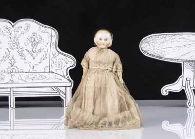 Lot 37 - A small early A.W. Fr Kister china headed young girl doll on taufling body
