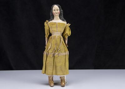 Lot 52 - A rare mid 19th century German papier-mache shoulder-head doll with elaborate hair