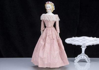 Lot 92 - A fine German bisque shoulder-head lady doll with flowers in hair