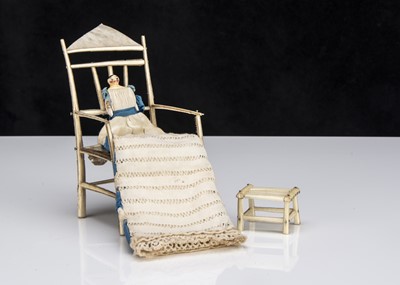 Lot 110 - A 19th century Grodnerthal dolls’ house baby in feather chair